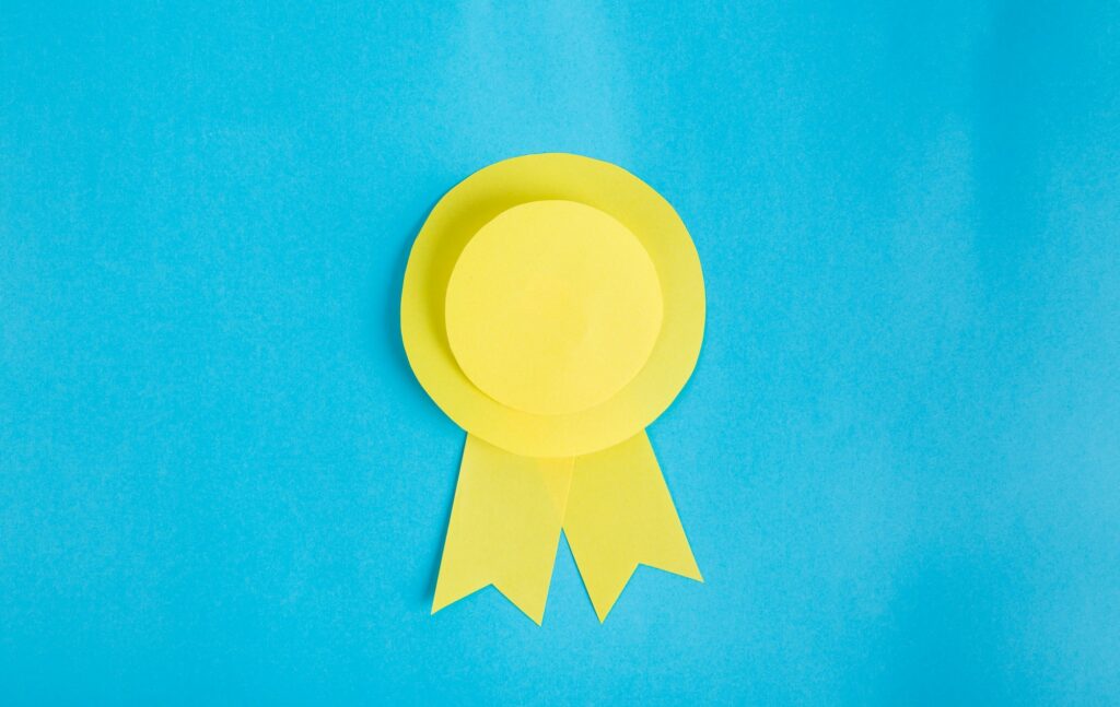 yellow rosette on blue background