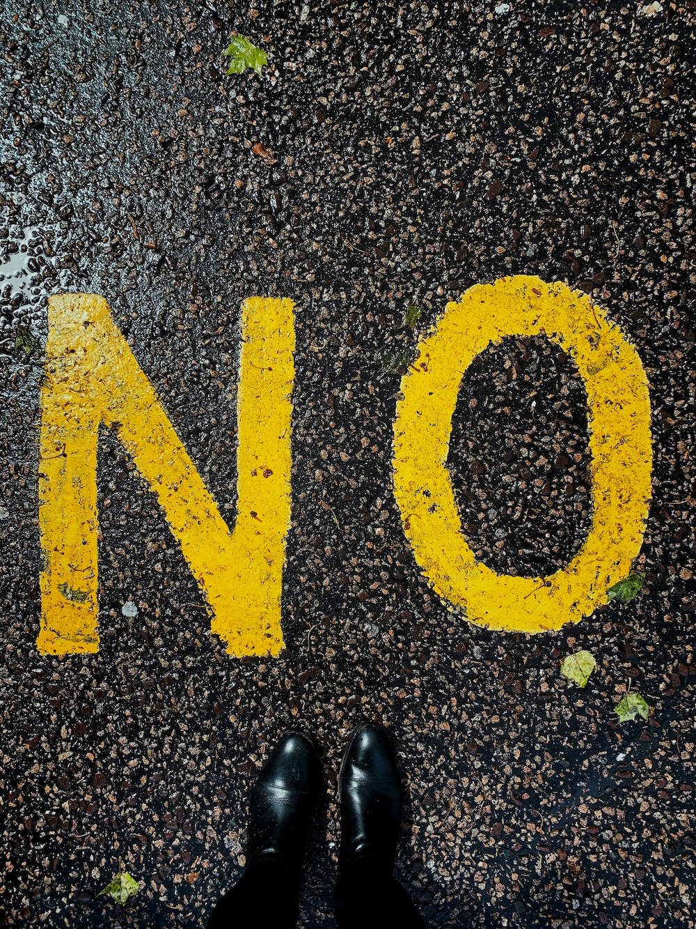 Road with NO written in yellow